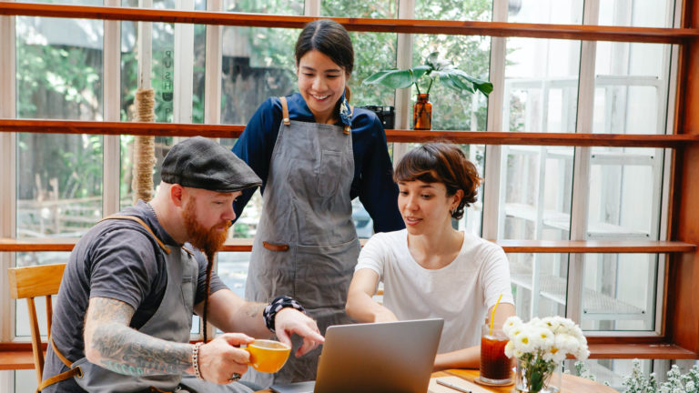 a group of people sitting around a table