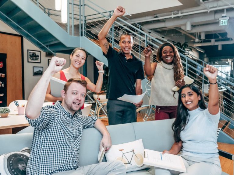 a group of people raising their hands