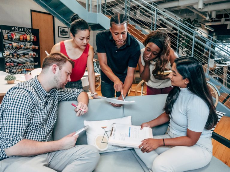 a group of people around a table