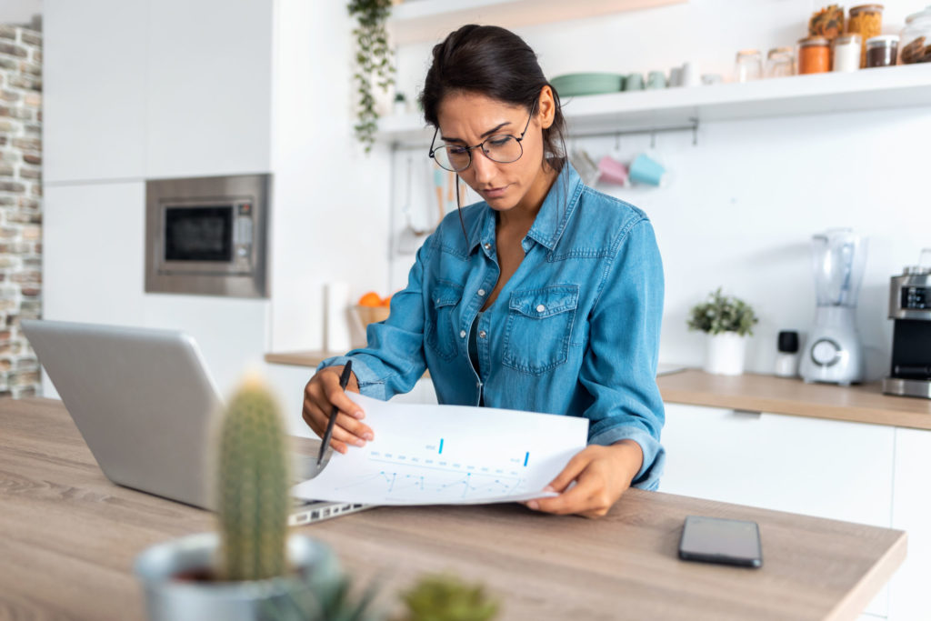 woman looking over paperwork