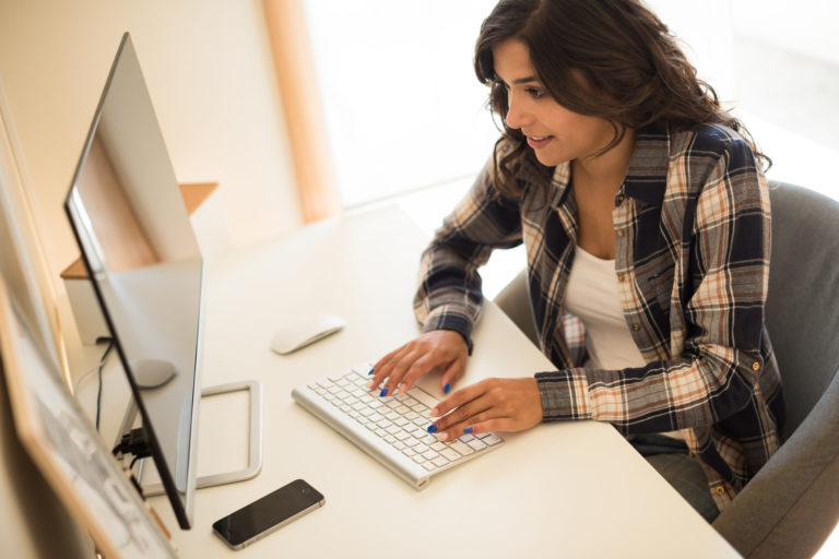 Woman programming computer